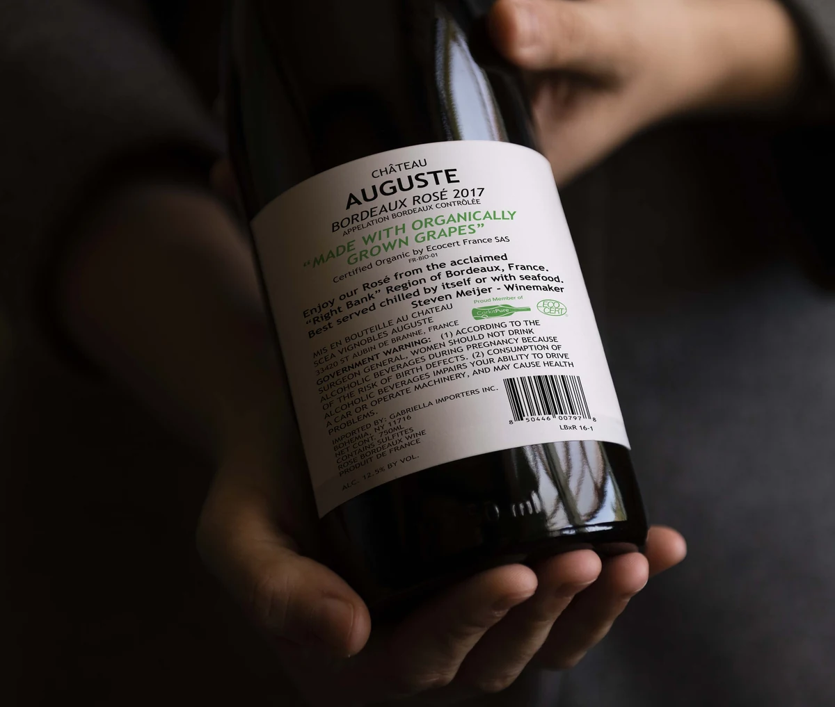 A bottle held by a winemaker, from the original CorkitPure site